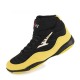 Chaussure de boxe jaune et noire de profil, sangle scratch