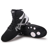Chaussures de boxe basses noir et blanc, bandes argent latérales