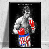 Tableau Rocky Balboa en garde, gants rouges et short americain sur fond noir, affiche dans un salon