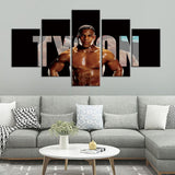Tableau Mike Tyson 5 pièces accroché au-dessus d'un canapé gris