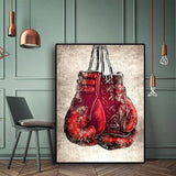 Tableau gants de boxe rouges laces suspendus sur fond creme, detail de l'impression